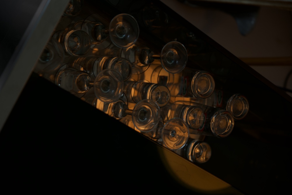 Cocktail glasses on the bar cart